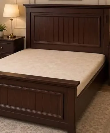 Classic timber bed with bedside cabinet and lamp