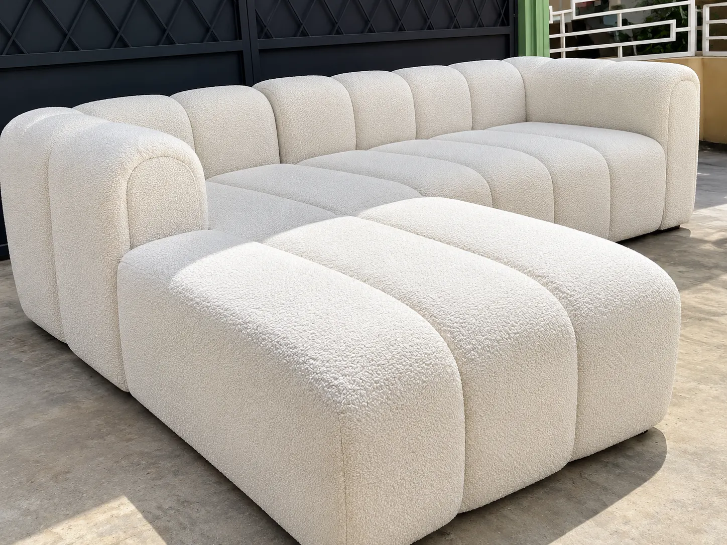 Ivory corner sofa with cushions for a Nairobi living room